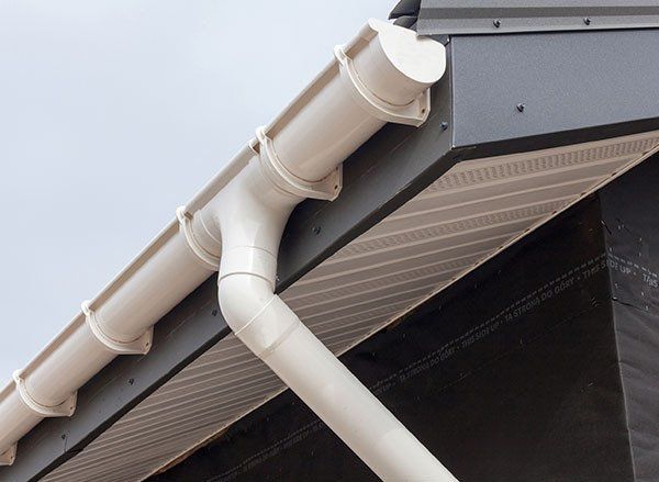 Metal Roof With White Rain Gutter — Guttering & Fascia in Coffs Harbour, NSW