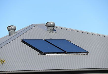 Two Whirly Vents on a Metal Roof With Solar Panels— Roof Repairs & Installation in Coffs Harbour, NSW