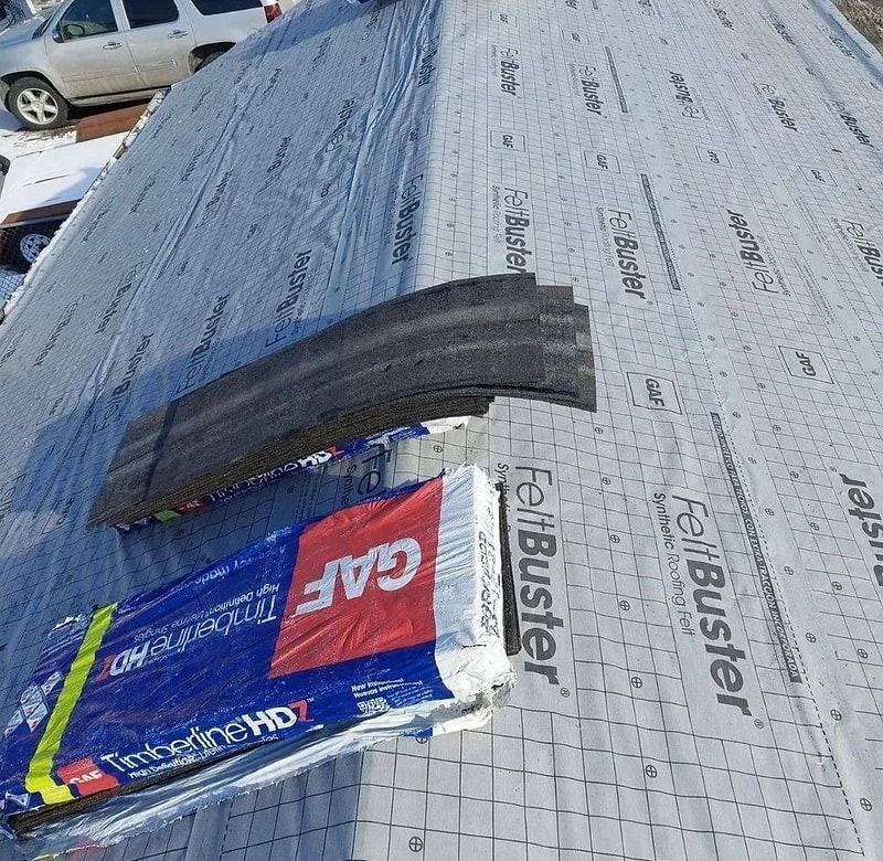 Roofing materials on a roof: GAF Timberline HDZ shingles, and FeltBuster underlayment.