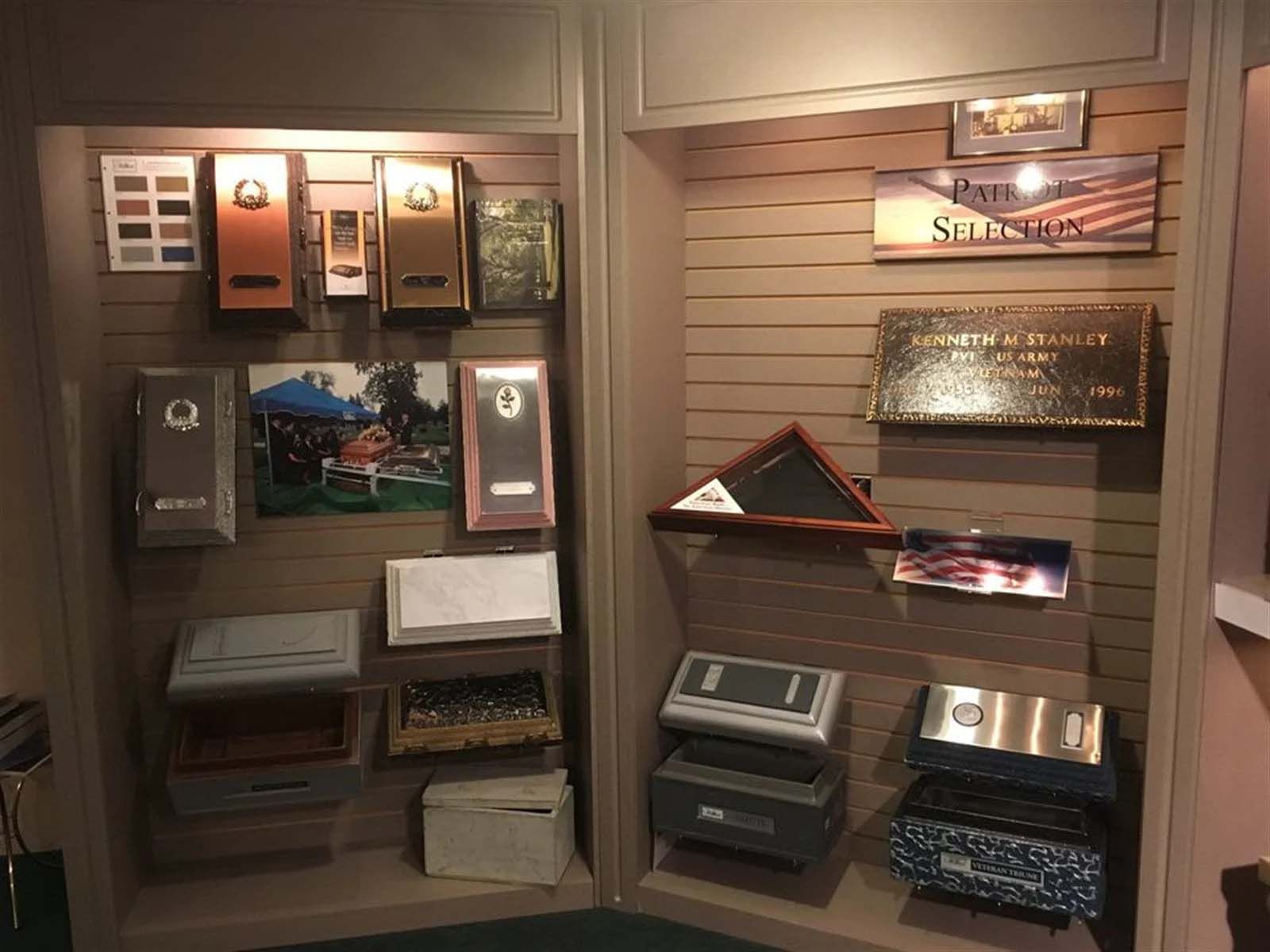 A display case filled with various boxes and plaques