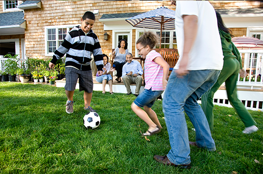 Family playing soccer - Family Medicine in Greenville, NC