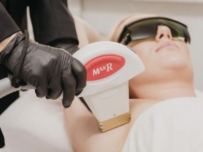 A person is getting a laser treatment on their leg.