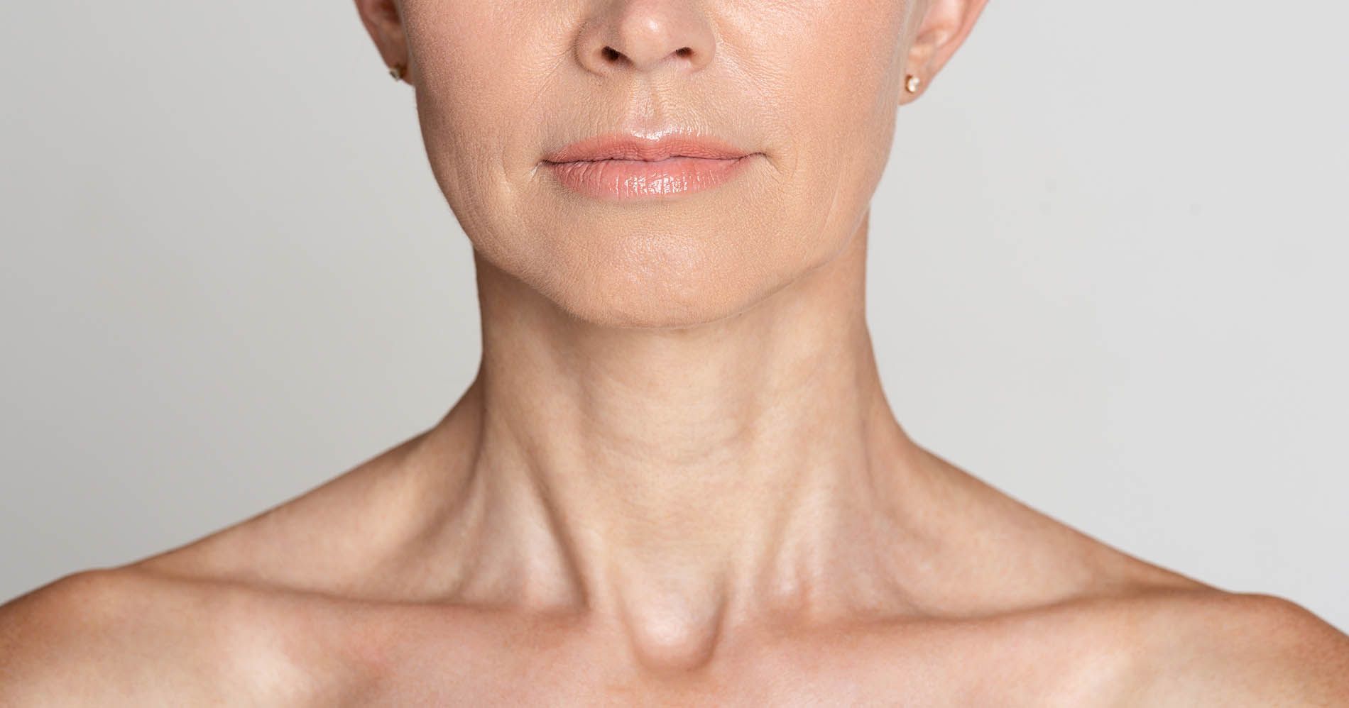 A woman is getting a laser treatment on her face.