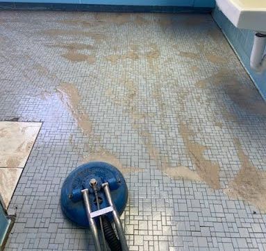 Dirty tiles getting scrubbed by On The Spot Cleaning