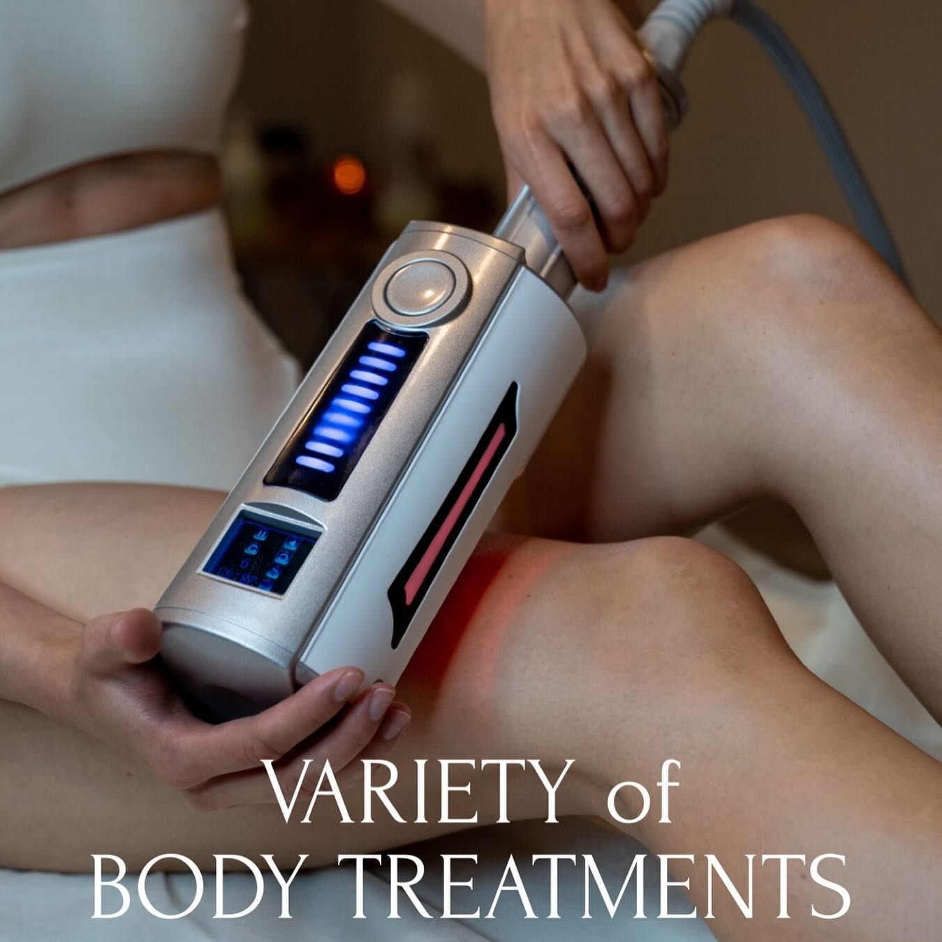 Person administering body treatment with a silver device on a knee. Text reads,