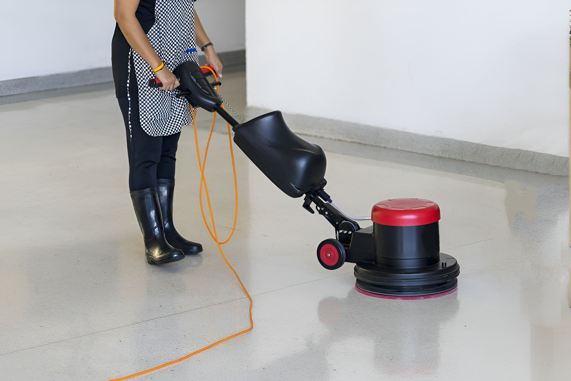 Person Using a Floor Polishing Machine on A Shiny, Light-Colored Floor — Clean Coast Carpet Cleaning in Port Stephens, NSW