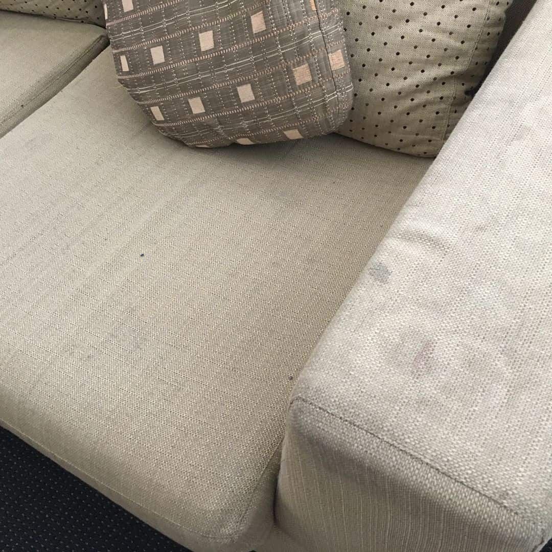 Beige Sofa with Stains and Decorative Pillows — Clean Coast Carpet Cleaning in Port Stephens, NSW