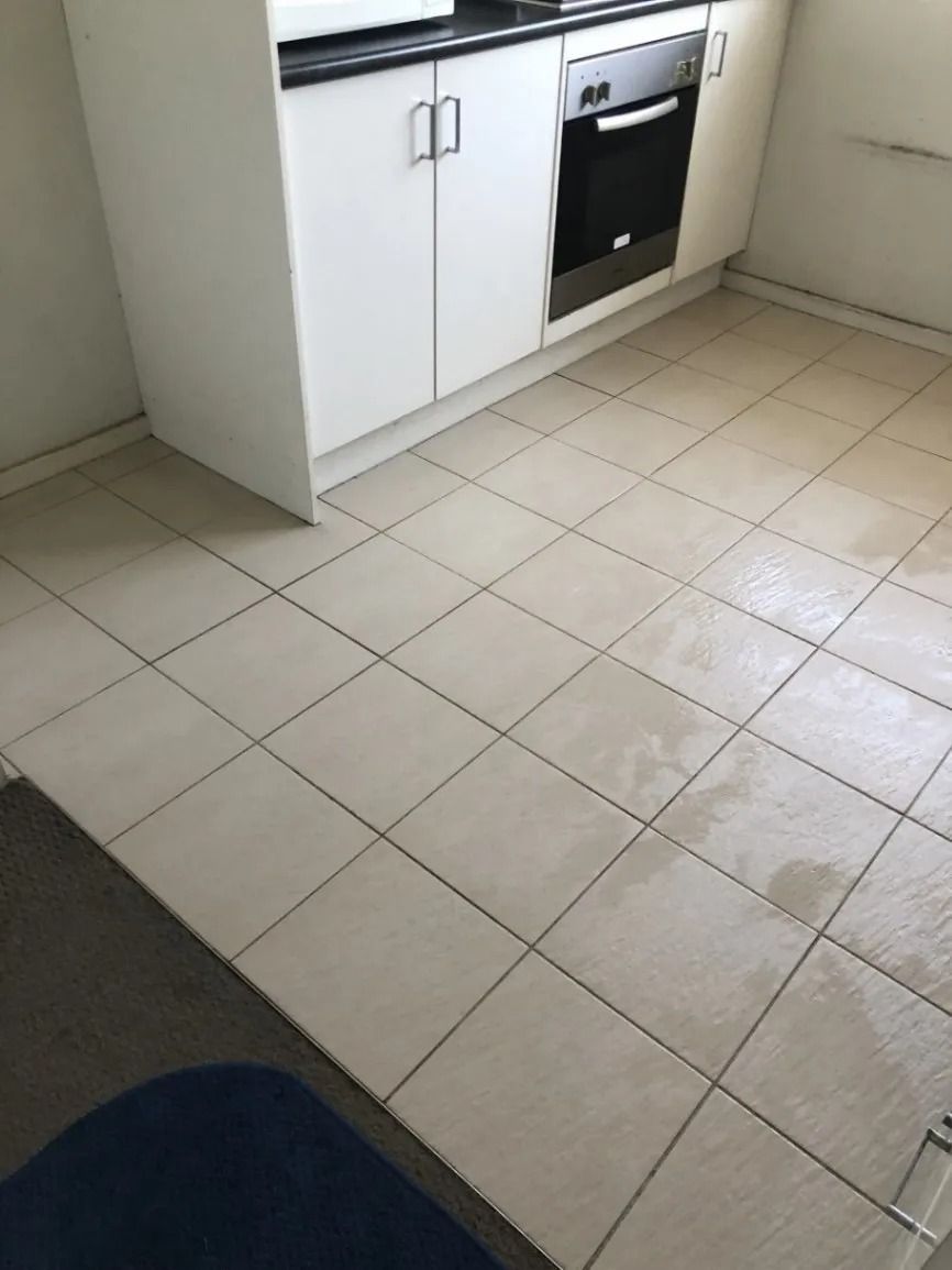 White Tile Kitchen Floor, Cabinets, and Oven — Clean Coast Carpet Cleaning in Port Stephens, NSW