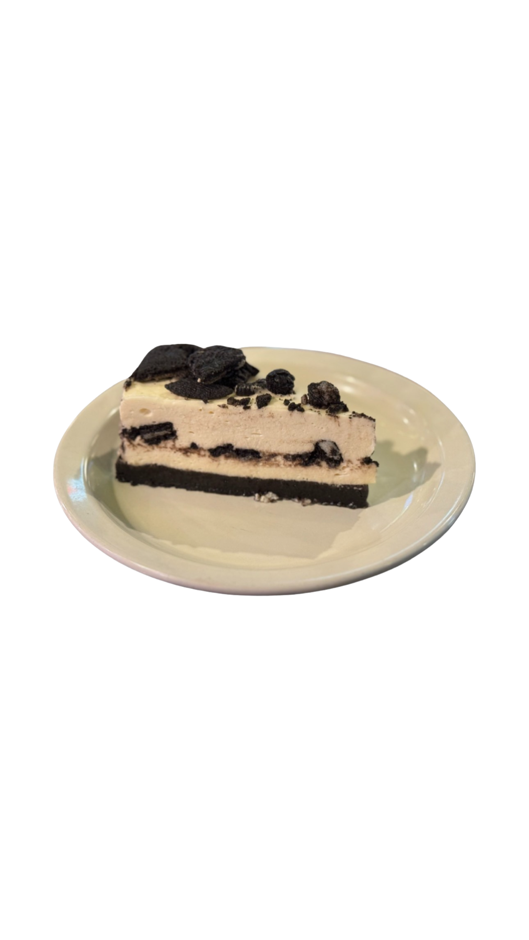 A slice of oreo cheesecake on a white plate at Swanky's in Denver, CO