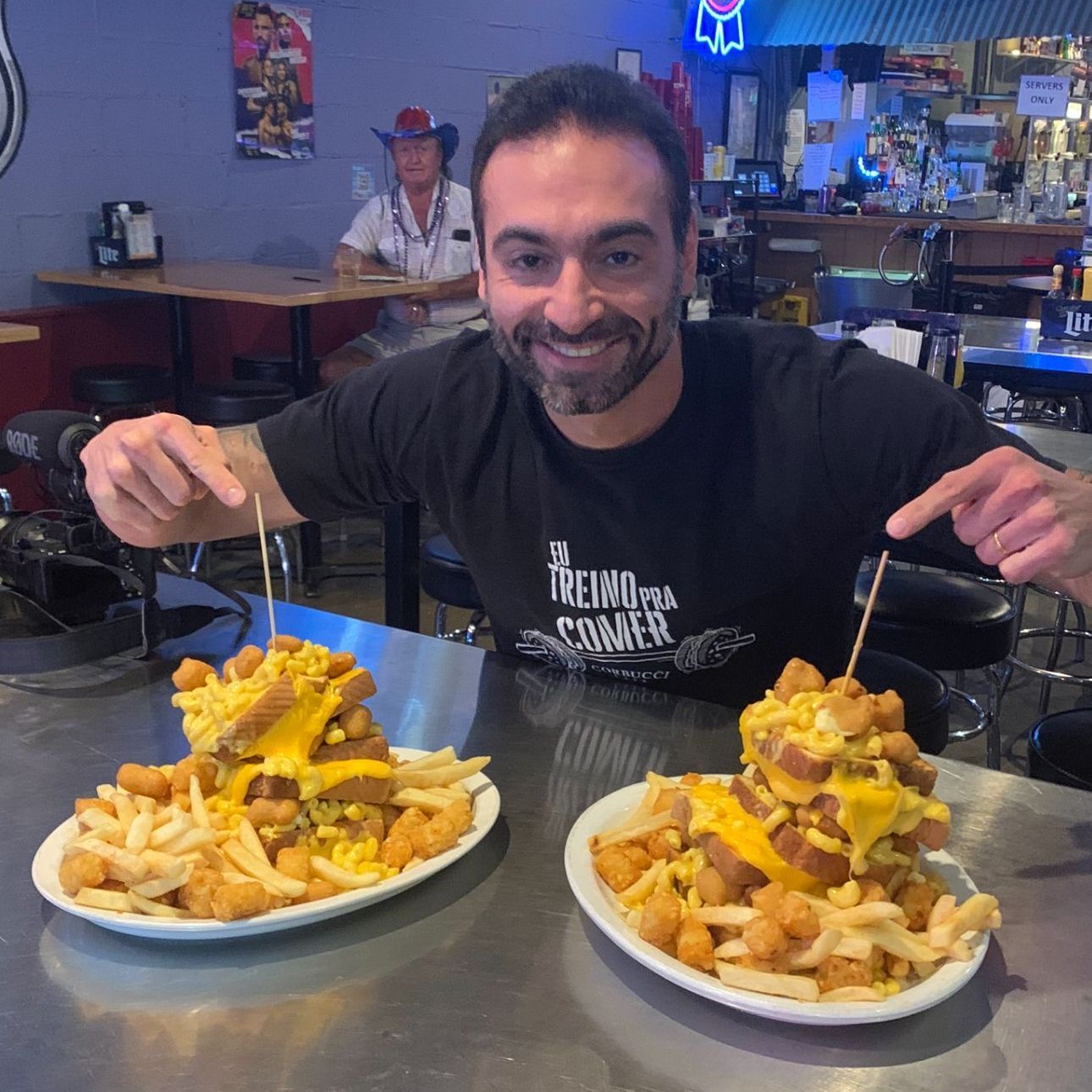 A man eating the food challenge at swankys sports bar. a bar for wisconsin and midwest sports fans