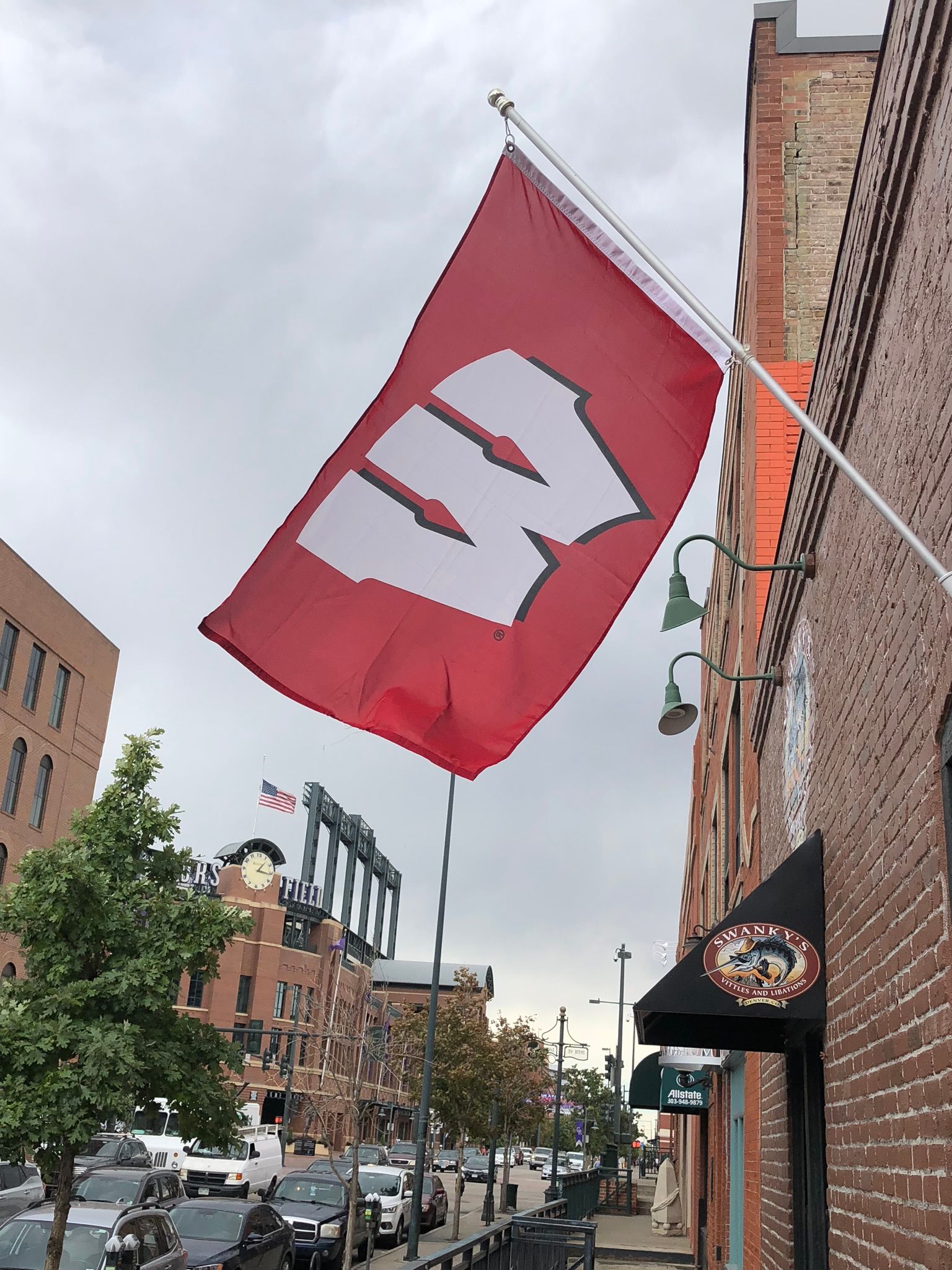 swanky's sports bar flag with Wisconsin W on it