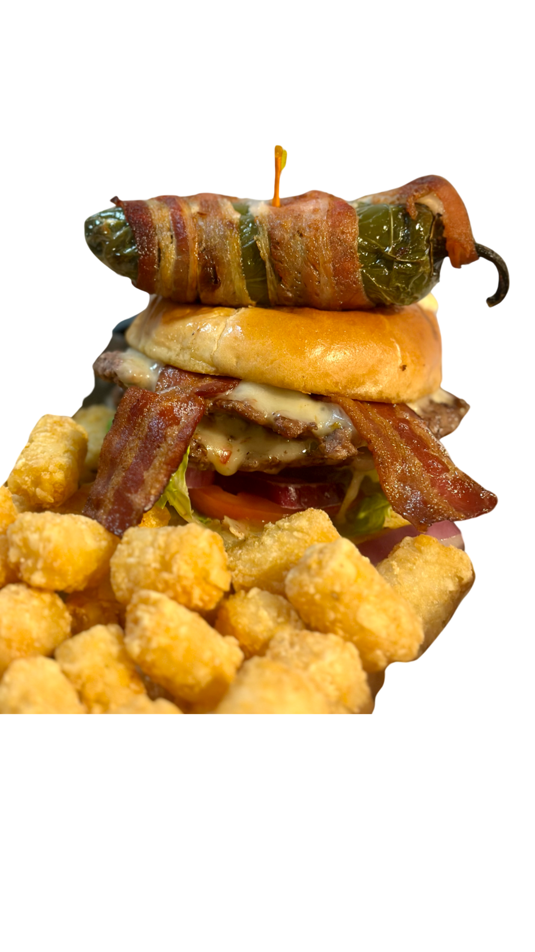 A hamburger is sitting on top of a pile of tots at swanky's sports bar in denver colorado