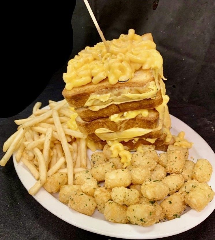 A plate of food with a sandwich and french fries at swankys sports bar in denver colorado