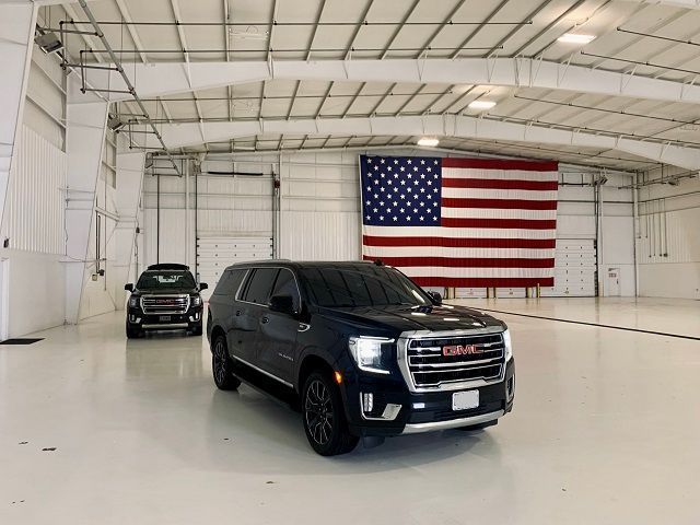 Black Yukon and American Flag STL Executive Transportation