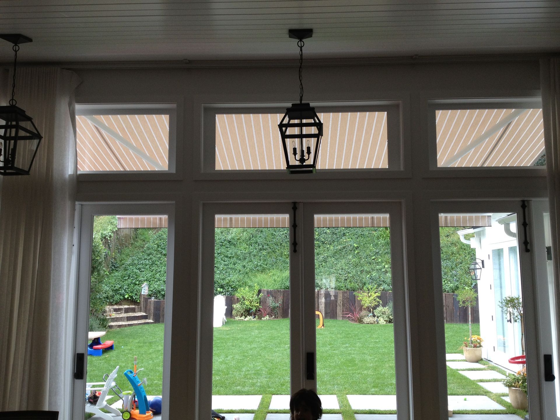 A view of a backyard through a sliding glass door