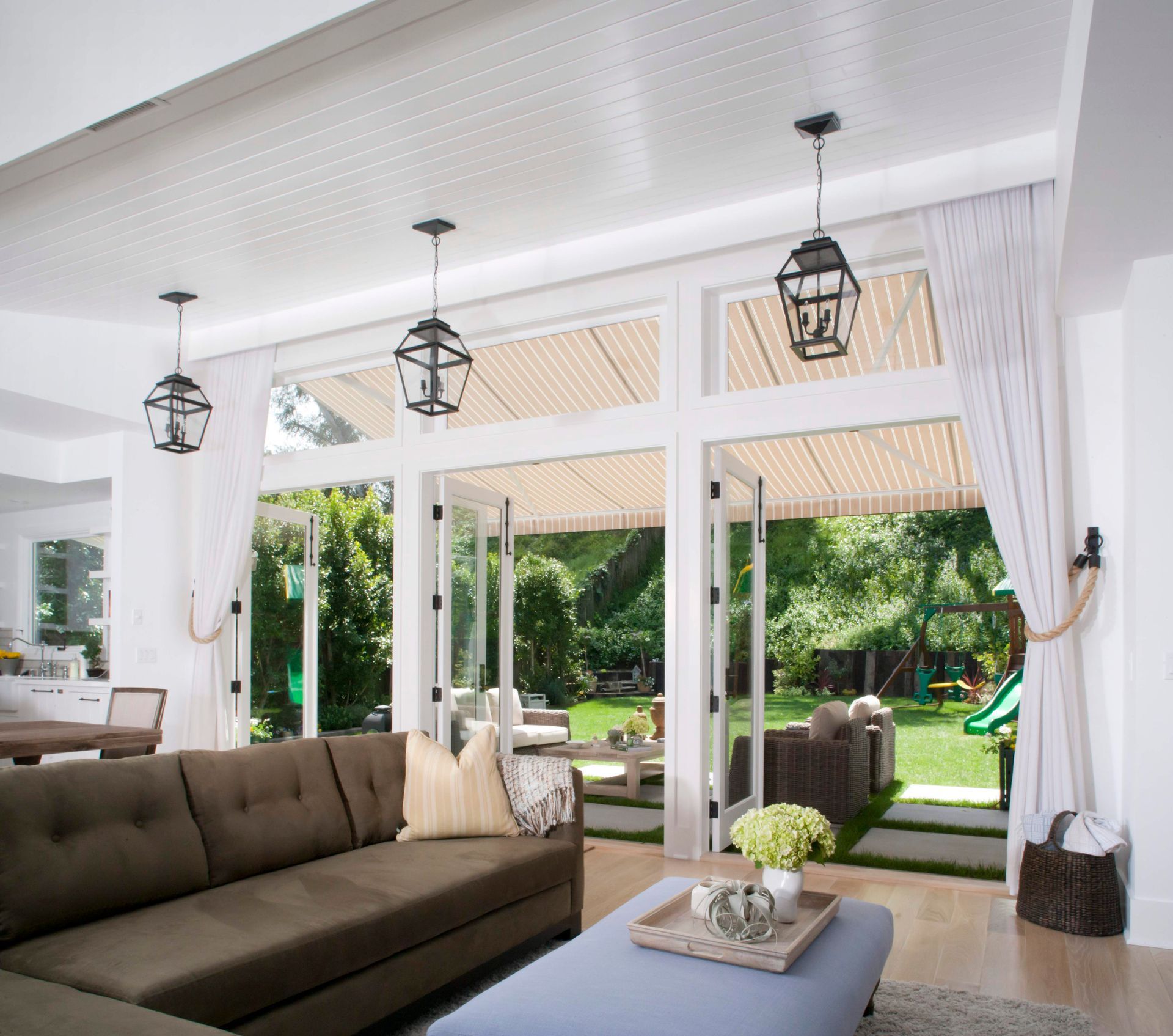 A living room with a brown couch and a blue coffee table