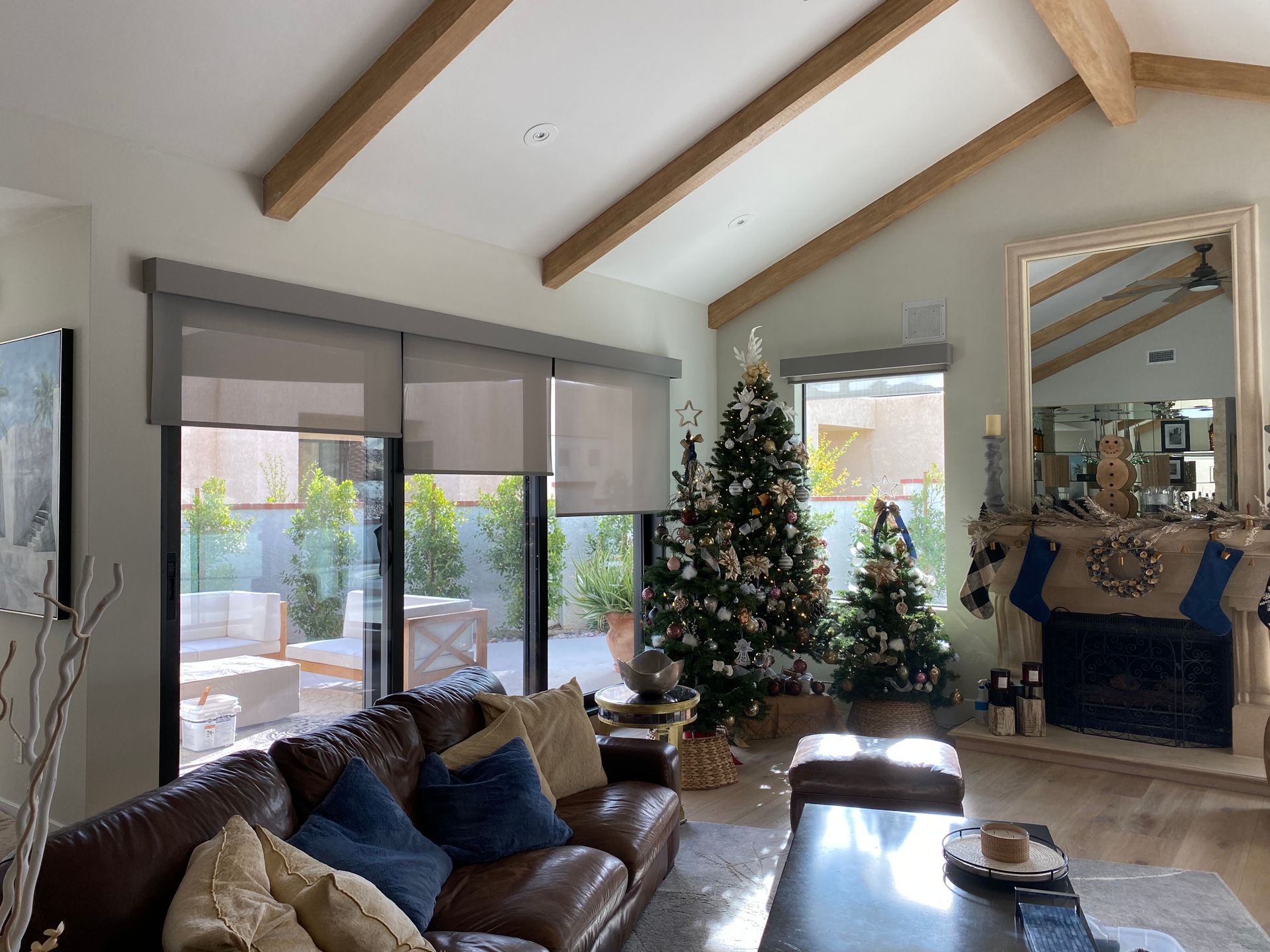 A living room with a couch and a christmas tree