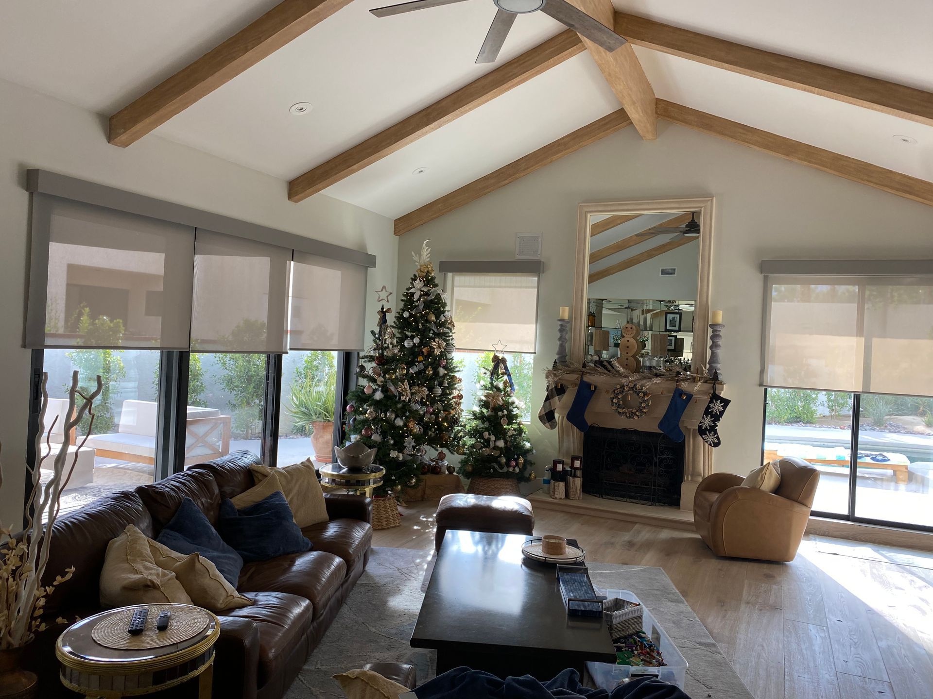 A living room filled with furniture and a christmas tree.