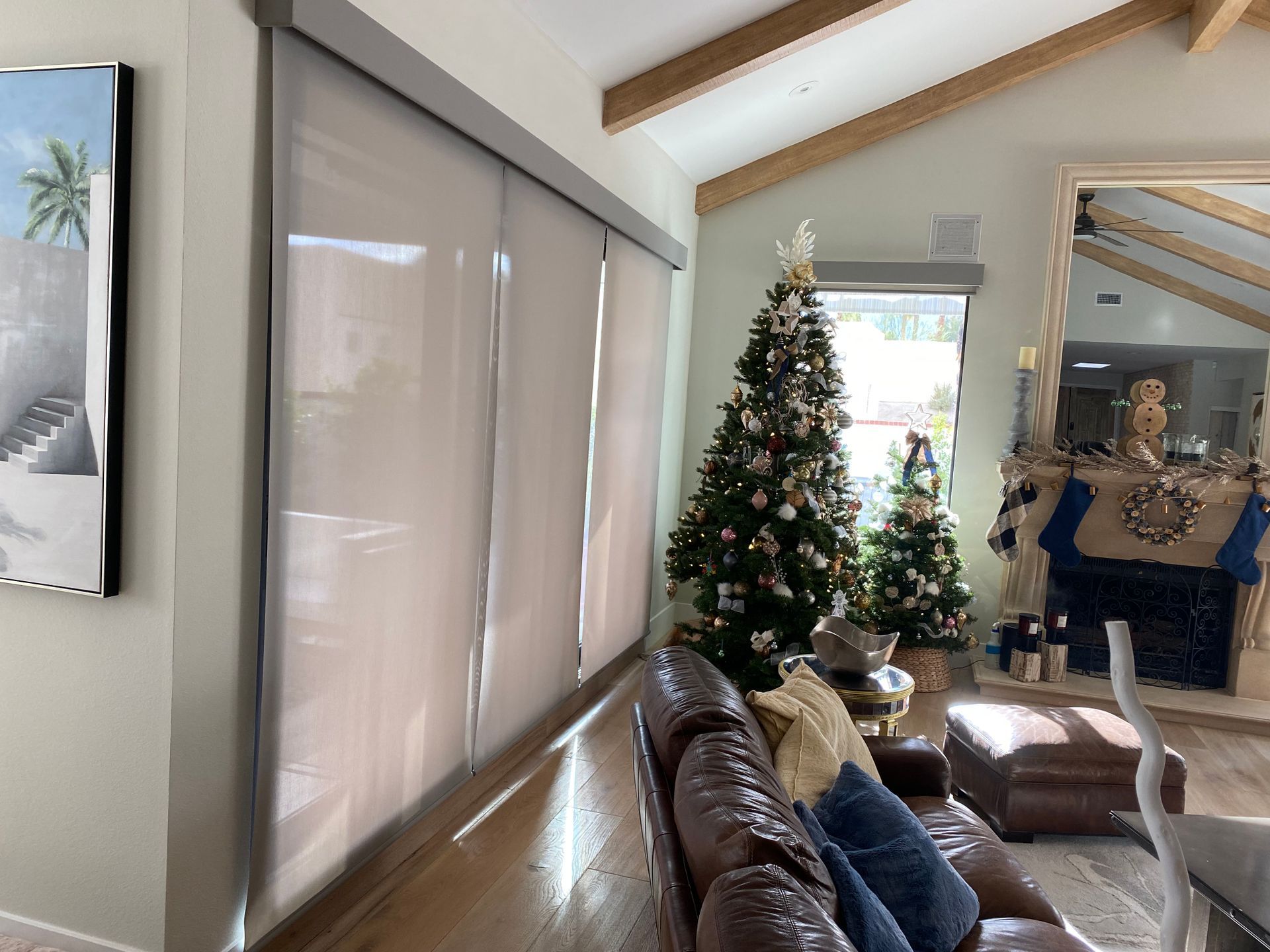 A living room filled with furniture and a christmas tree.