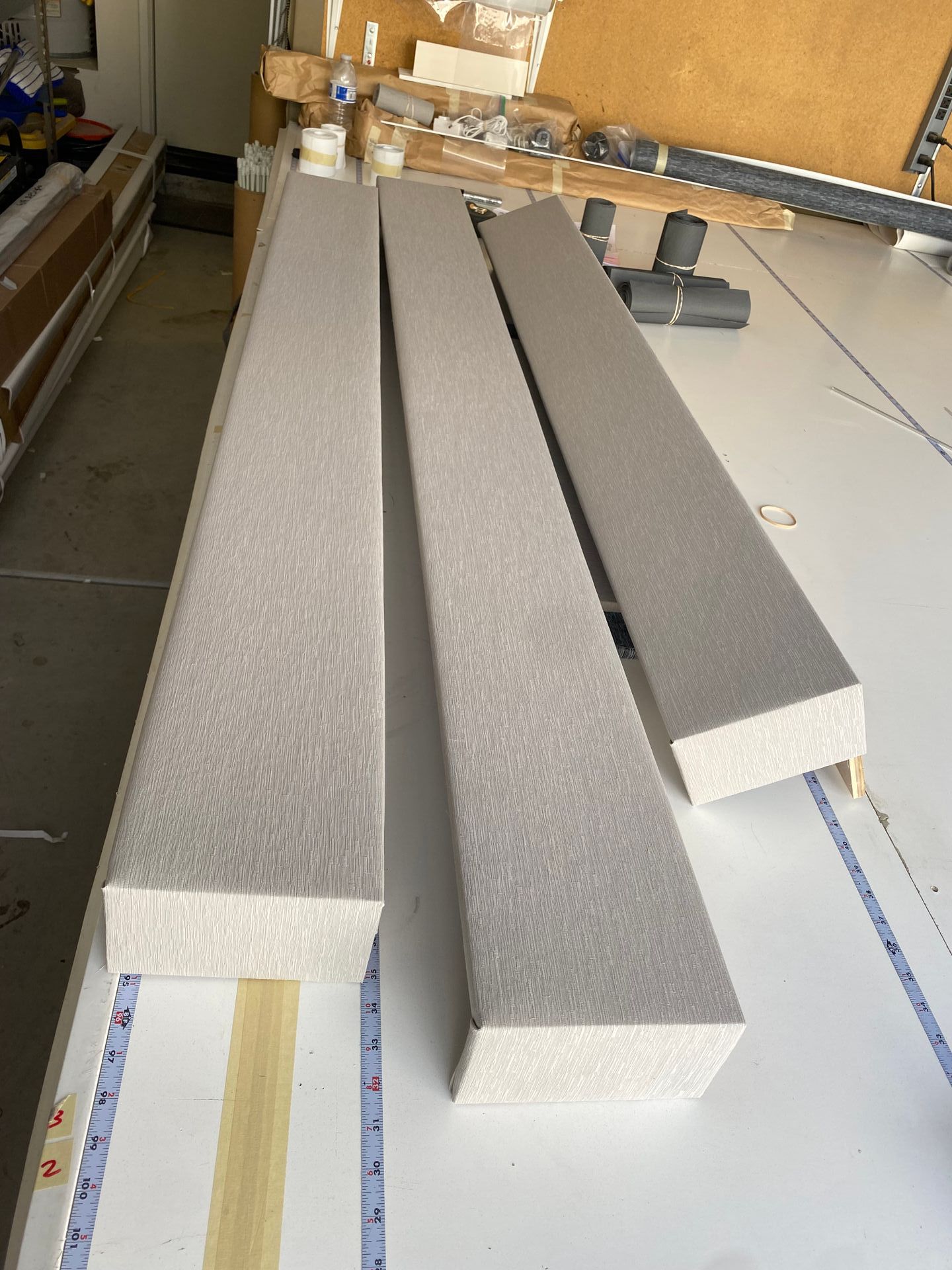 Two pieces of foam are sitting on a white table