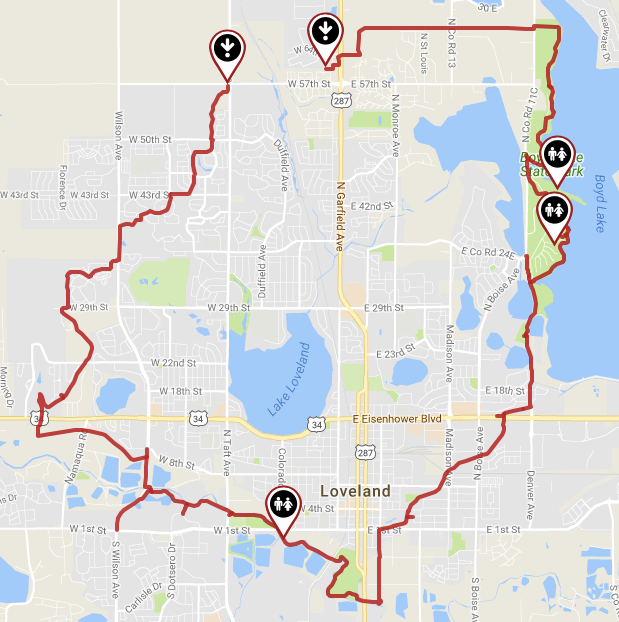 Map of Loveland, Colorado, with a red highlighted route and four black location icons, adjacent to a lake.