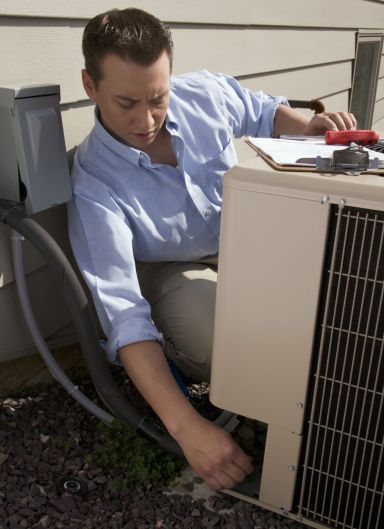 Man services air conditioning systems in Melbourne
