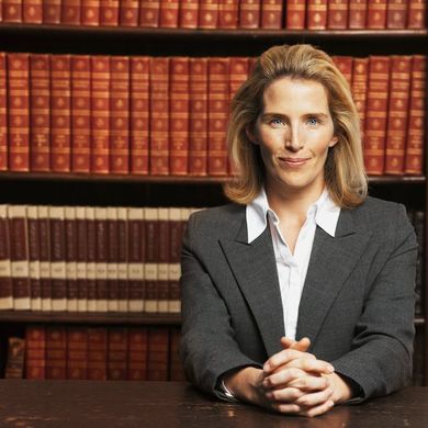 Attorney in front of bookshelves — law firm in Los Angeles, CA