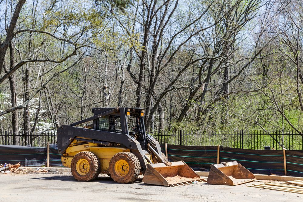 Yellow and Black Skid Steer Loader Parked on Pavement — Shantui QLD in Warwick, QLD