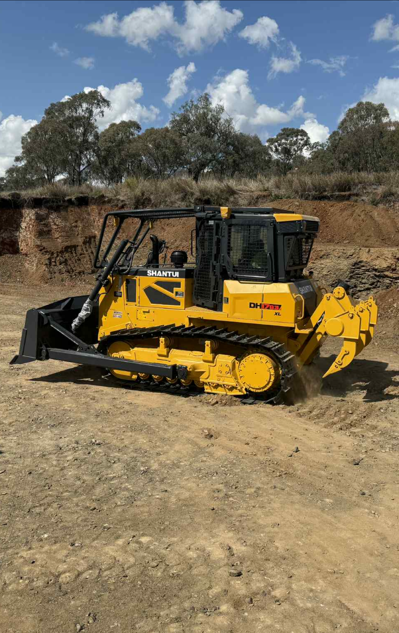 Yellow Bulldozer on A Construction Site Pushing Dirt — Shantui QLD in Kingsthorpe, QLD