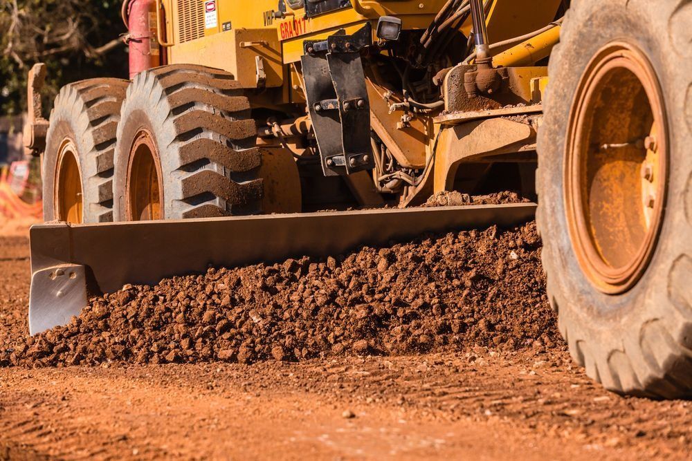 Yellow Grader Smoothing Red Dirt Road — Shantui QLD in Dalby, QLD