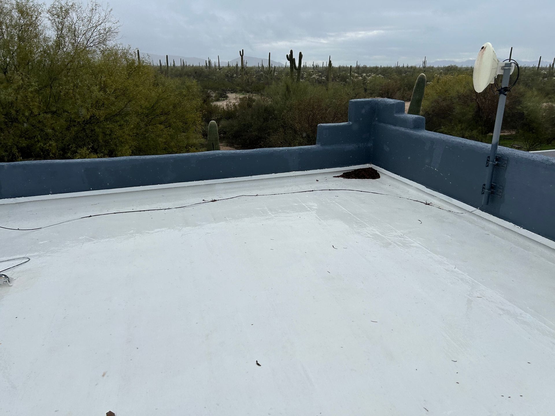 A white roof with a satellite dish on it