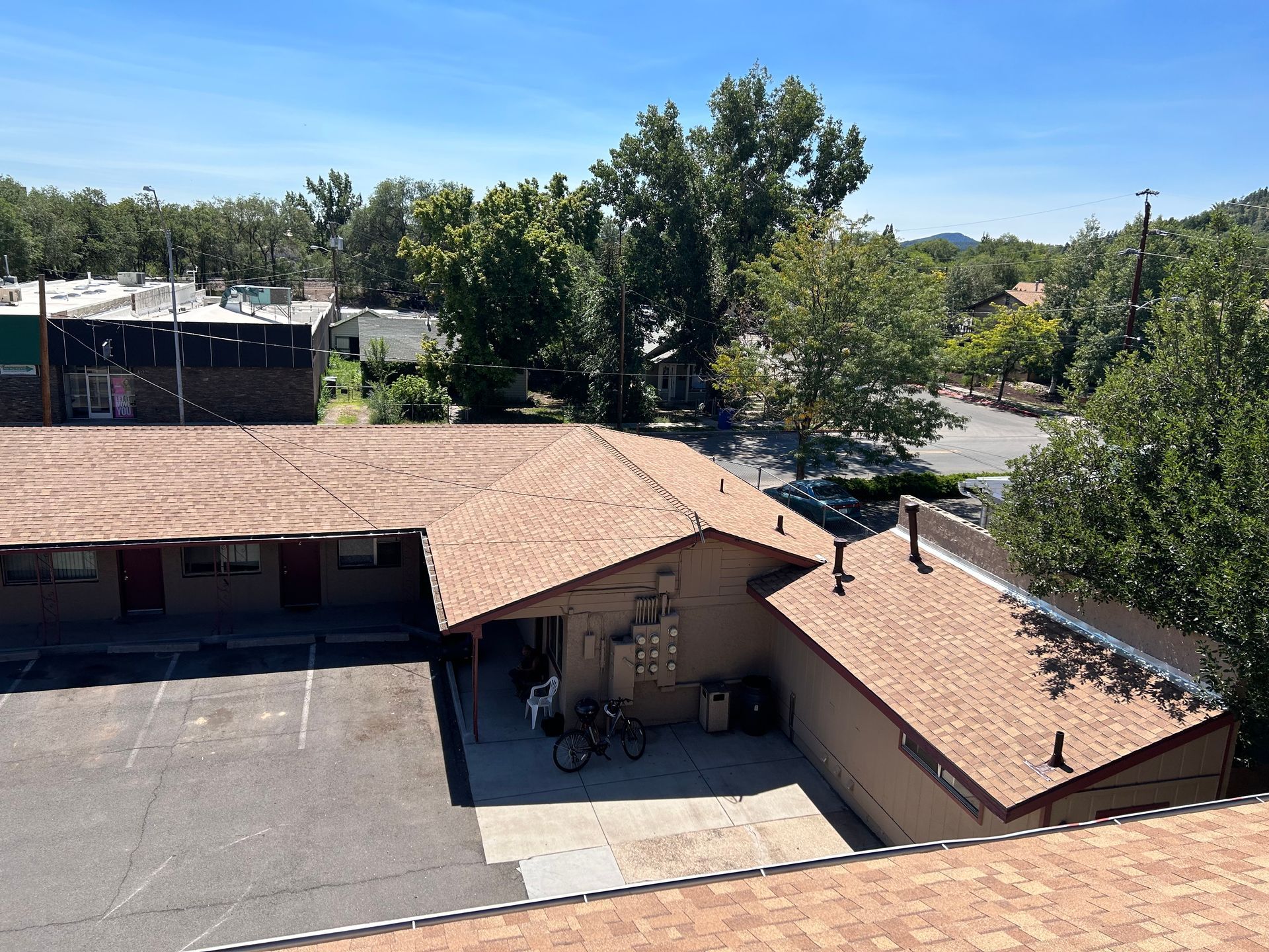 An aerial view of a building with a red roof