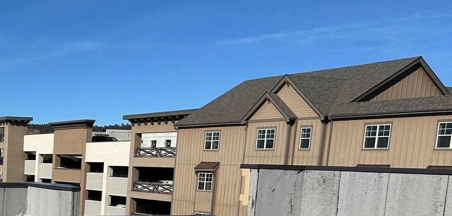 A row of buildings with a blue sky in the background