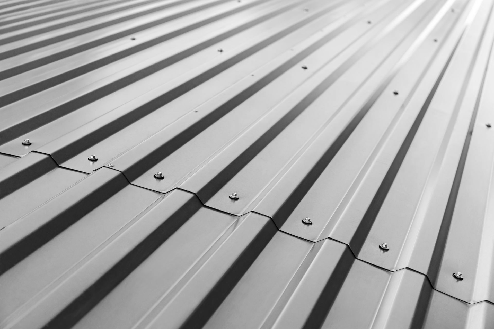 A black and white photo of a metal roof.