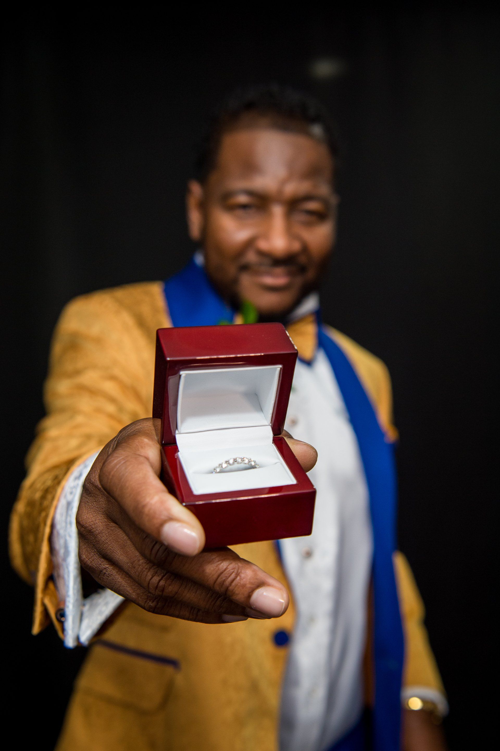 Man In Suit Holding Wedding Ring — Chicago, IL — Concept One Photography