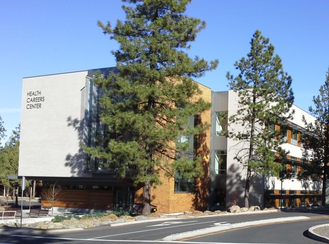 A building with trees in front of it — Scio OR — Rodgers Mountain Consultants, LLC