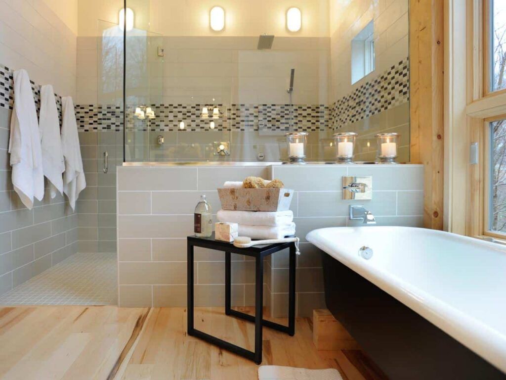 A bathroom with a bathtub and a walk in shower.