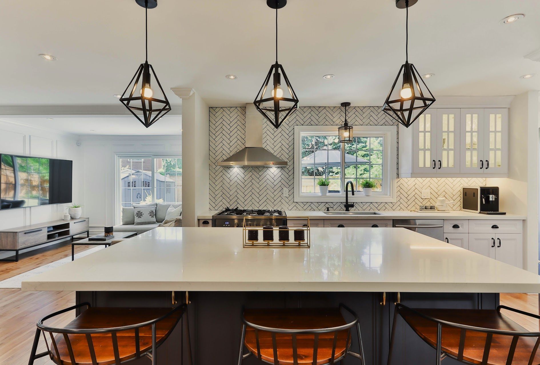 A kitchen with a large island and stools