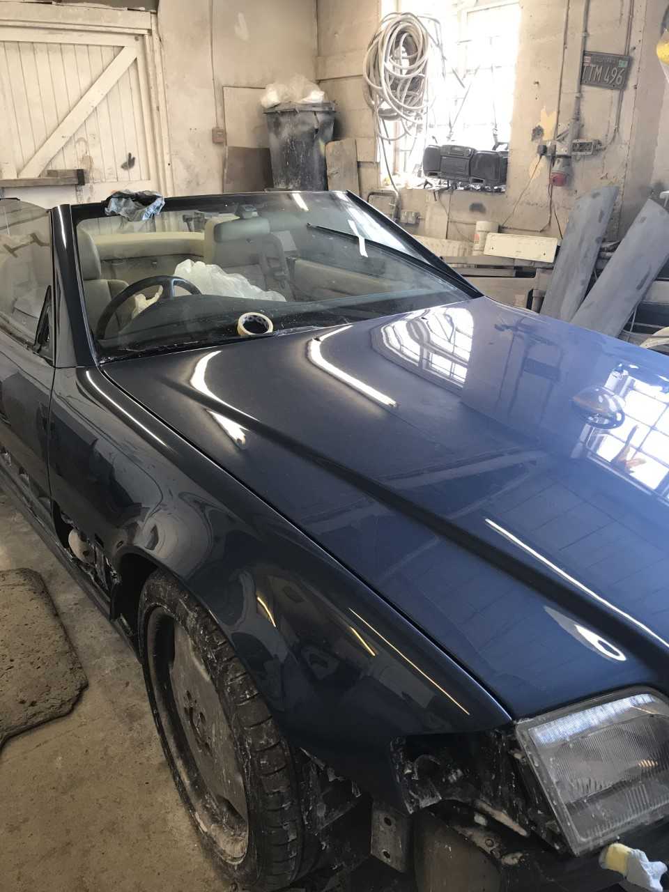 an old car with a large bonnet area