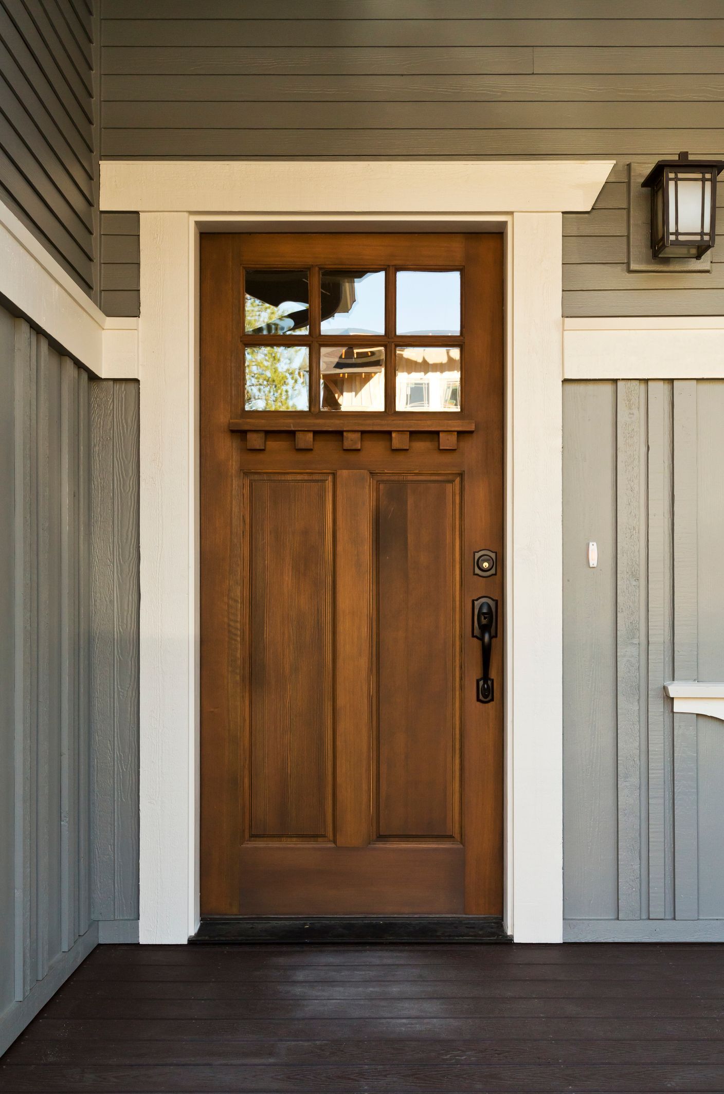 A close up of a wooden door on a house.