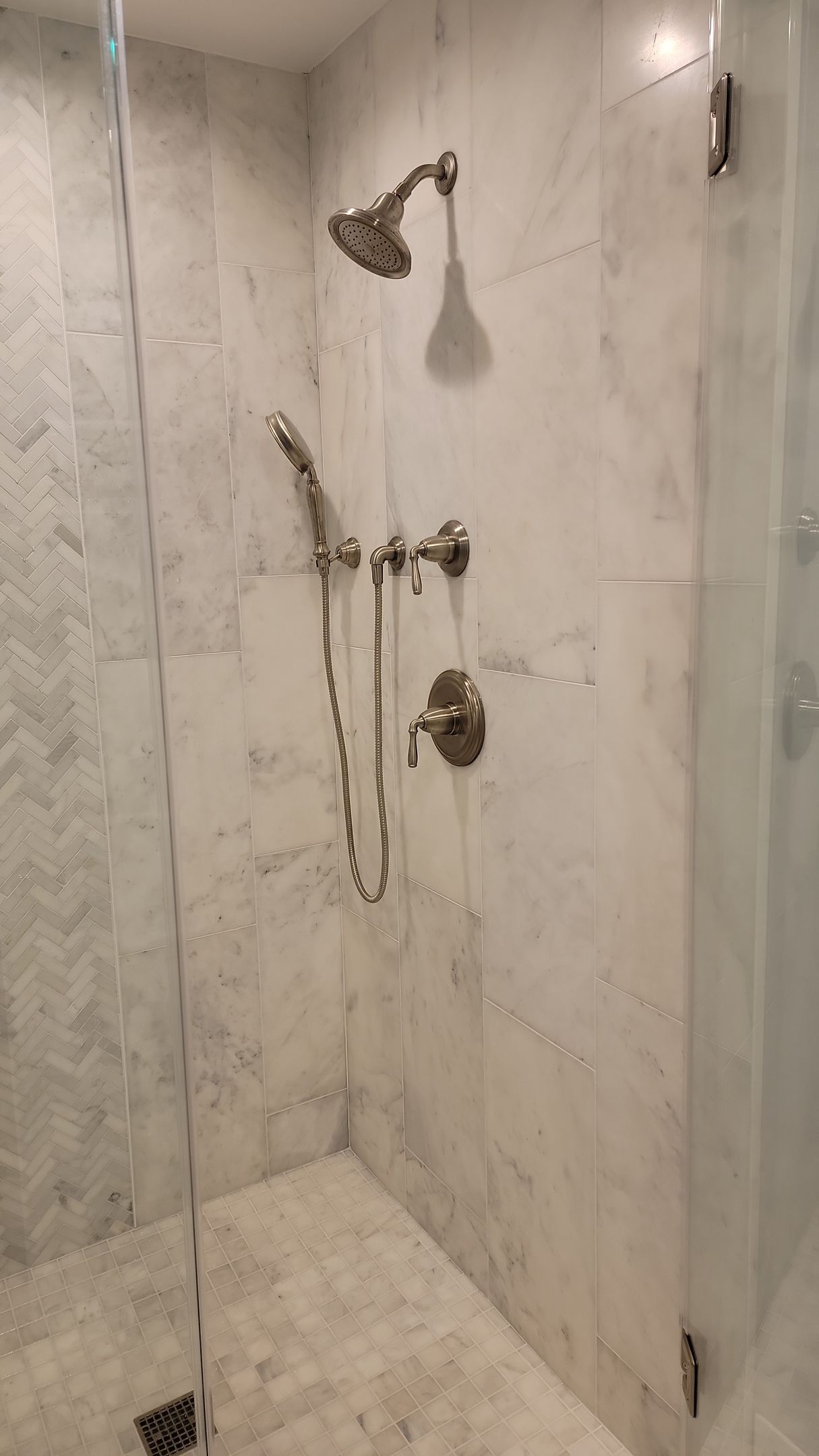 Marble walk-in shower renovation completed by Ashburn bathroom contractors