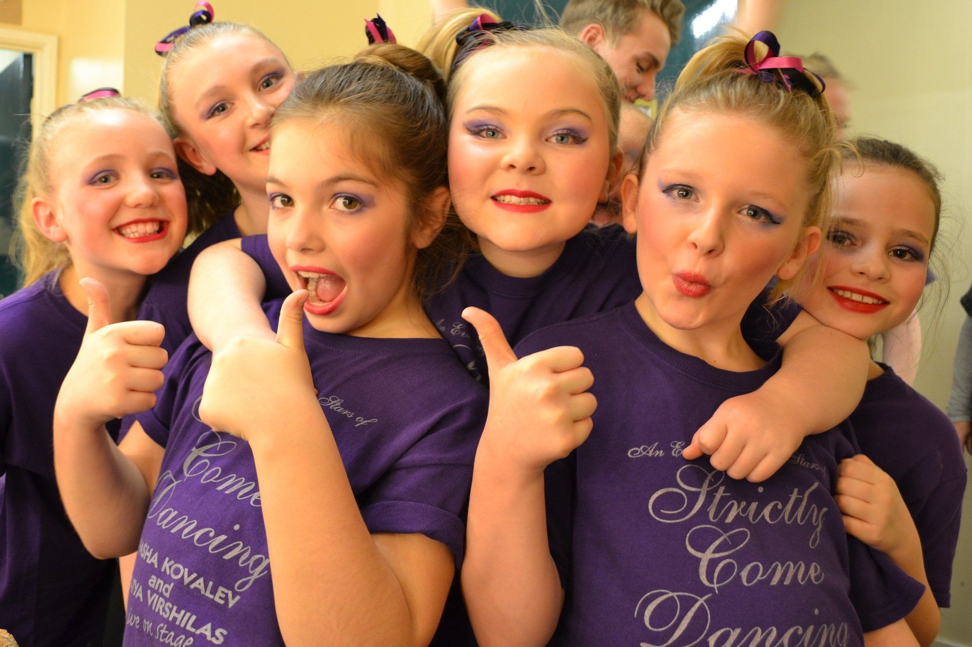 Kids showing thumbs up