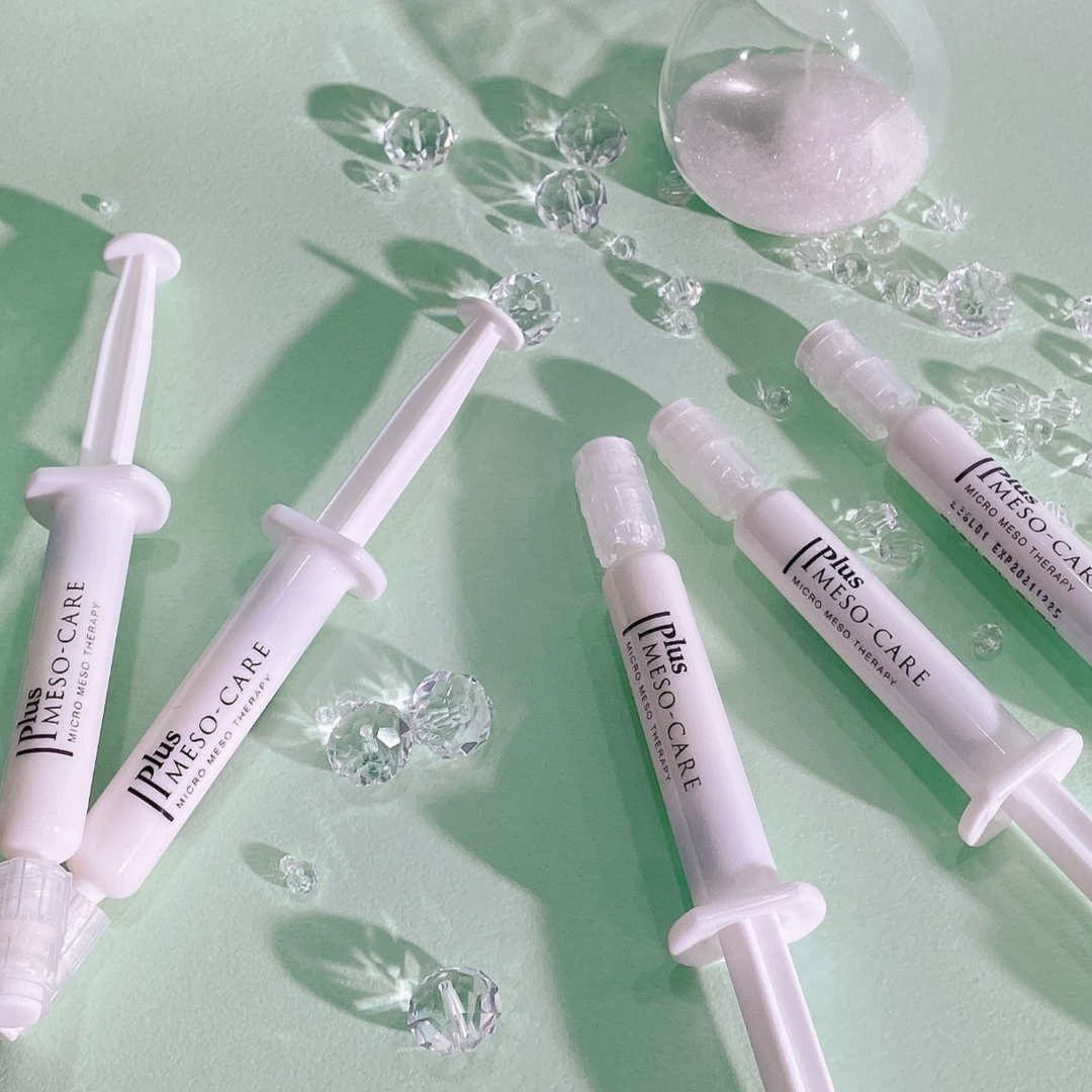 White syringes labeled 