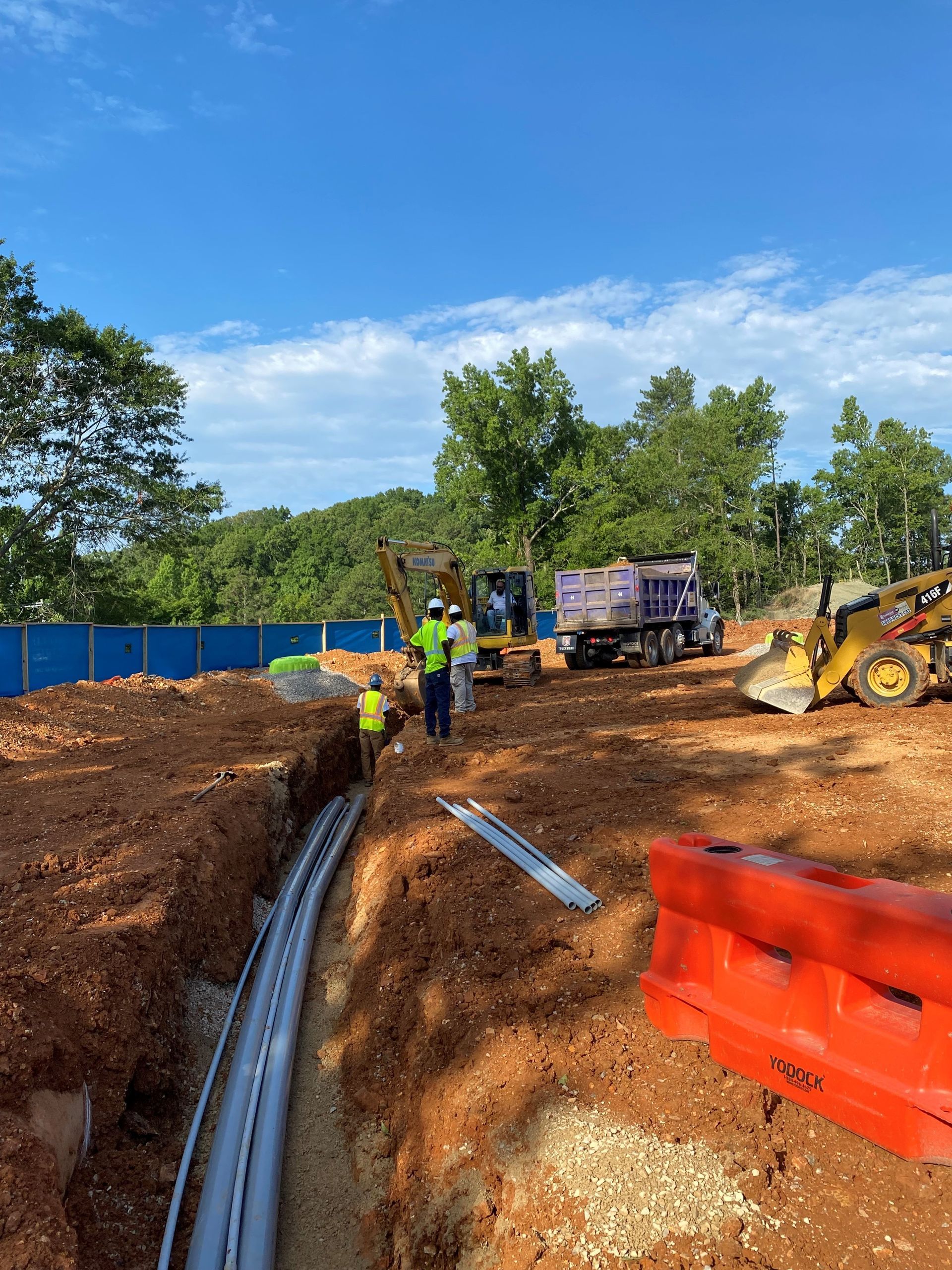 A group of construction workers are working on a construction site.