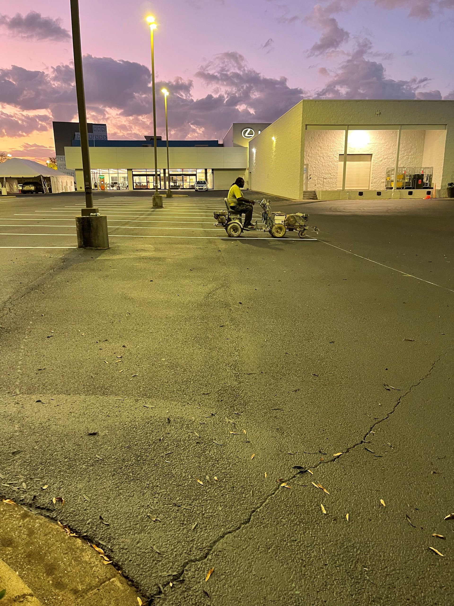 Worker Striping Road Lines — Birmingham, AL — Southeastern Sealcoating, Inc.