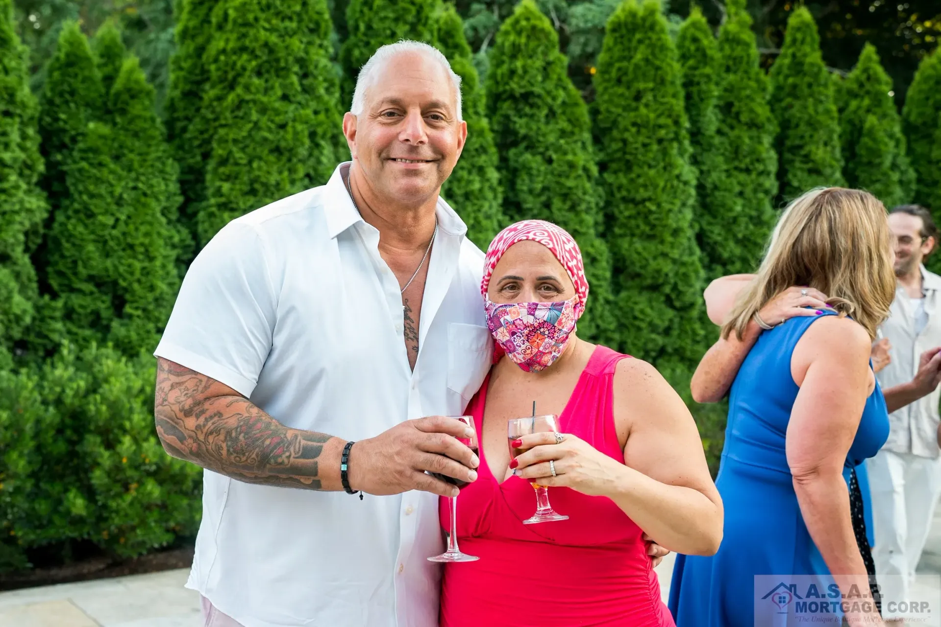 A man and a woman wearing face masks are posing for a picture.