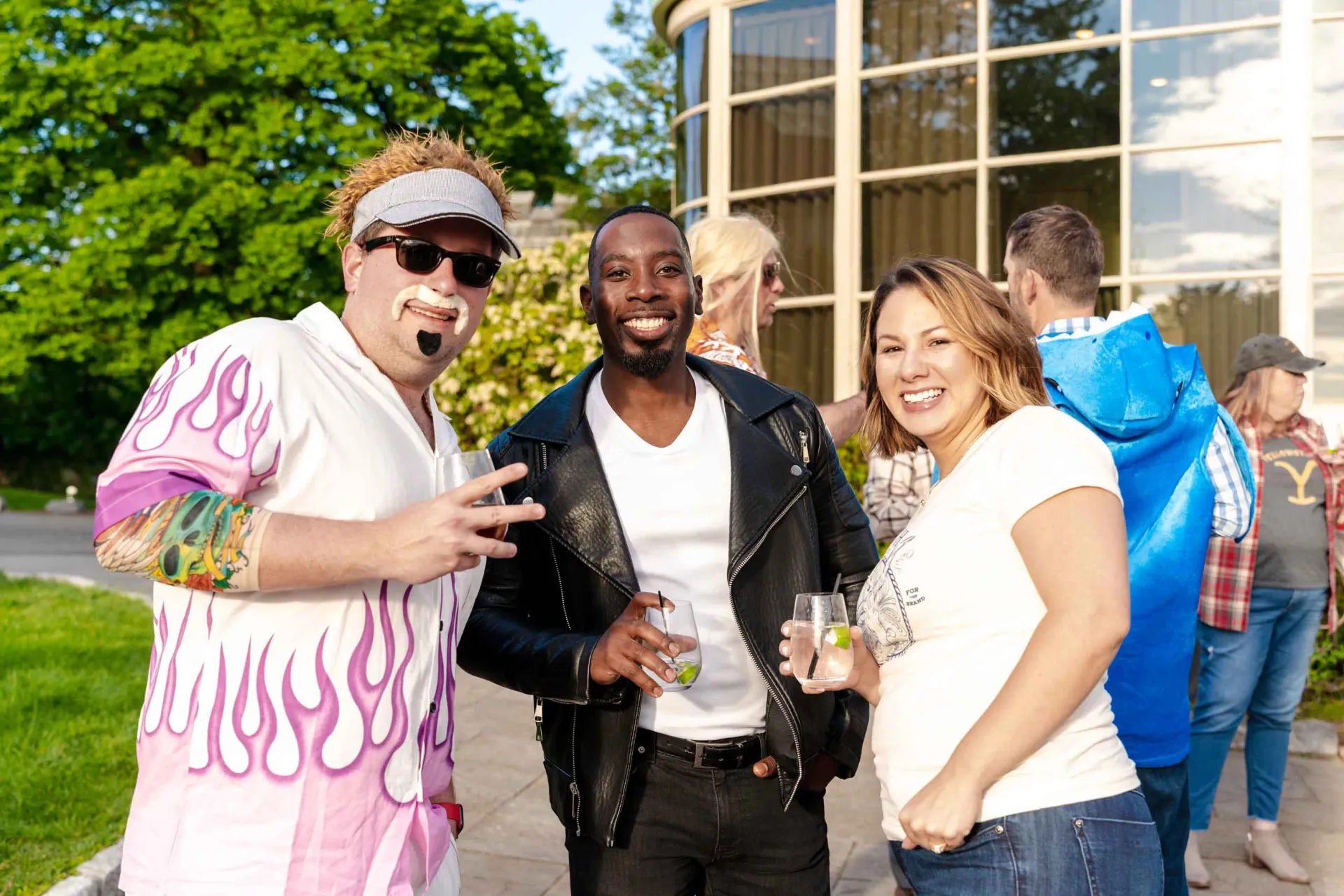 A group of people are posing for a picture in front of a building.