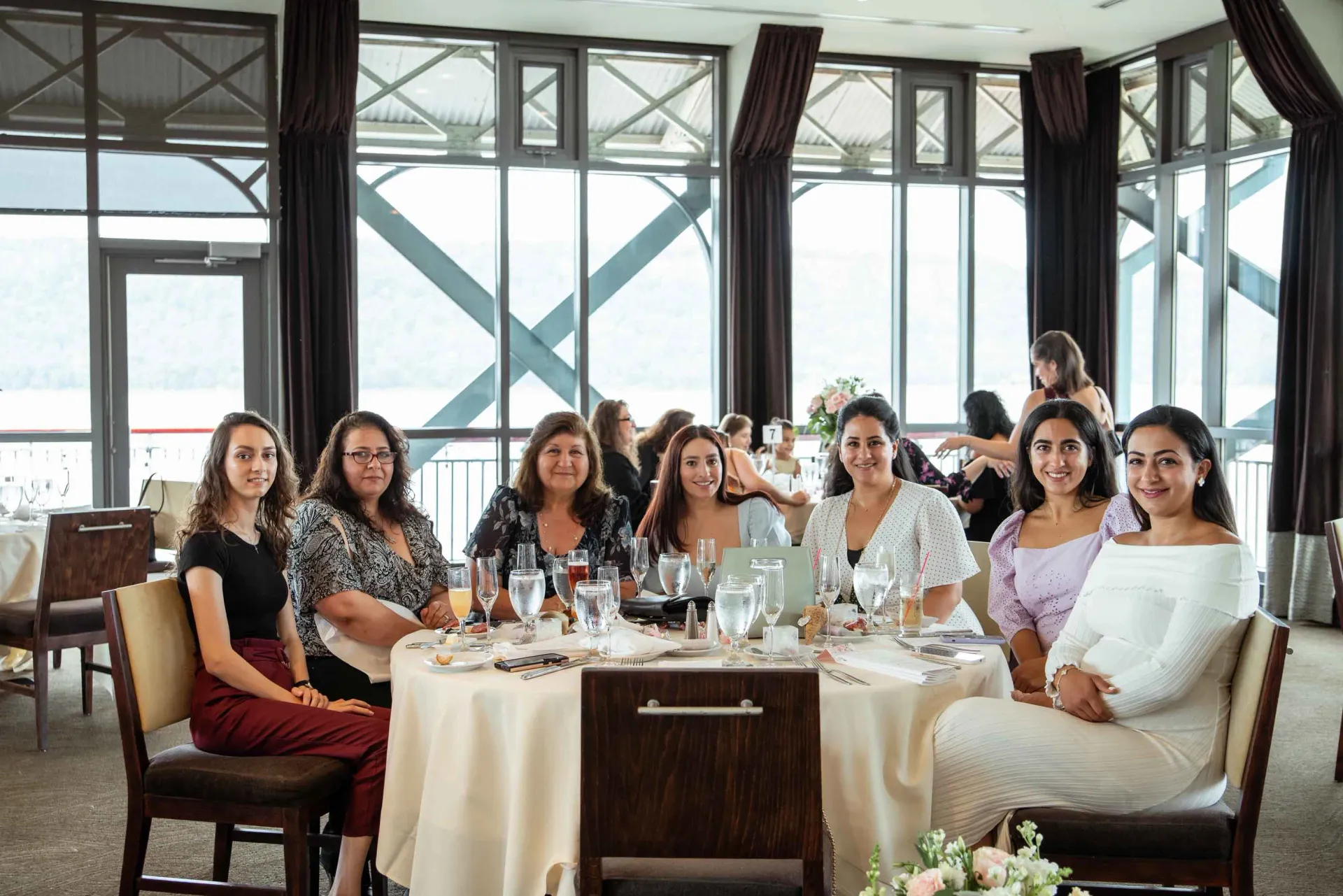 A group of women are sitting at a table in a restaurant.