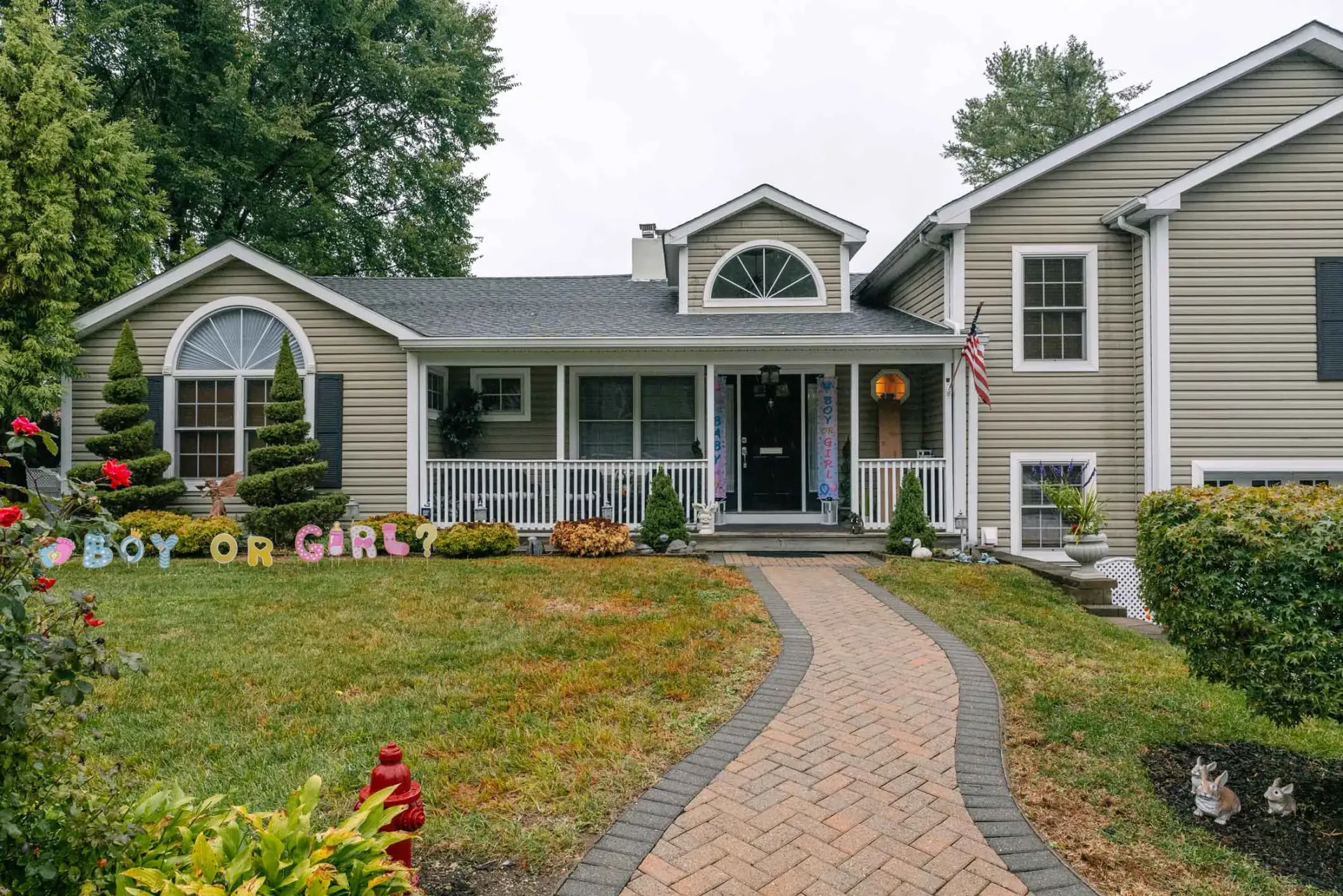 A house with a sign in front of it that says `` boy or girl ''.