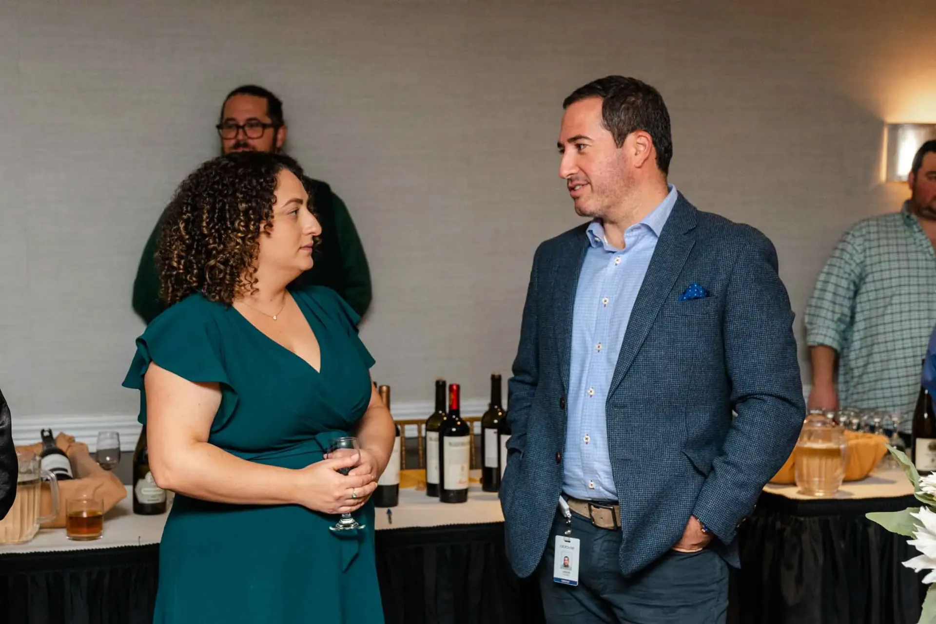 A man and a woman are talking to each other in a room.